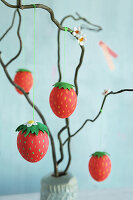 DIY strawberry-look Easter eggs on twigs