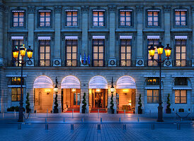 Facade and entrance of the Hotel Ritz in the evening, Paris, France