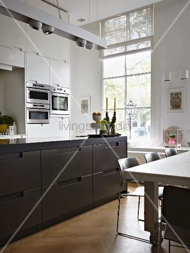 White Kitchen Cabinets With Brown Island modern kitchen with floor to ceiling window white fitted cupboards and dark brown