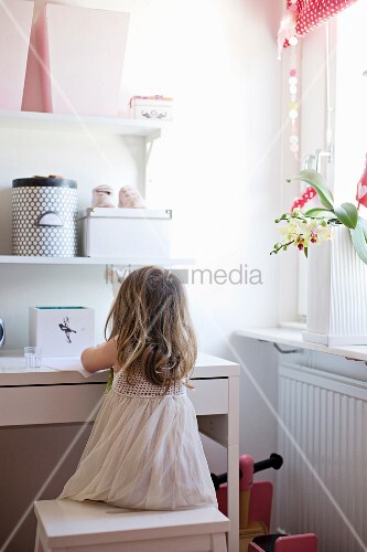 Little Girl Sitting On Stool At White Buy Image 11264714
