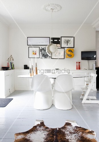 White Panton Chairs Around An Oval Table Buy Image