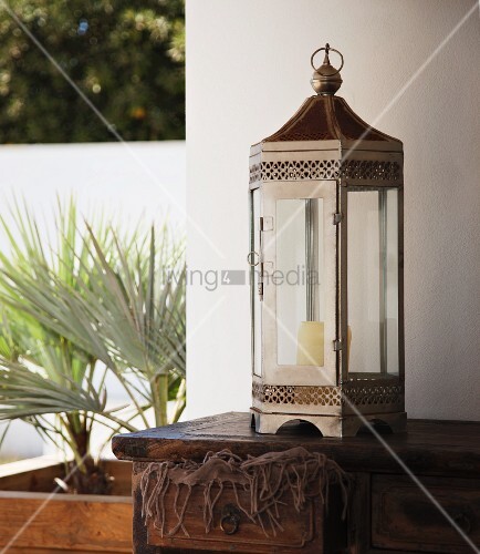Metal Oriental Style Lantern On Wooden Chest Of Drawers Bild