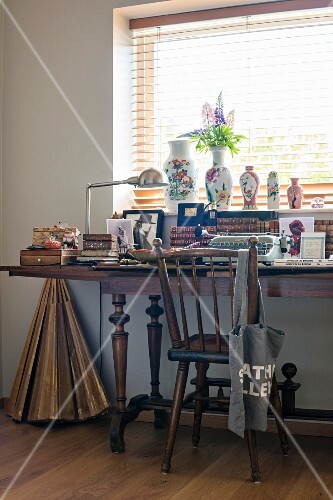 Antique Wooden Chair At Cluttered Desk Buy Image 11447438