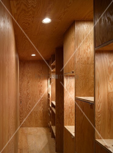 Narrow Hallway With Wood Paneling On The Buy Image