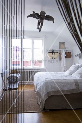 View Through String Curtain Into Bedroom Buy Image