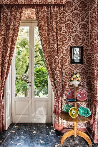 Three Tiered Table Against Patterned Buy Image 12237708