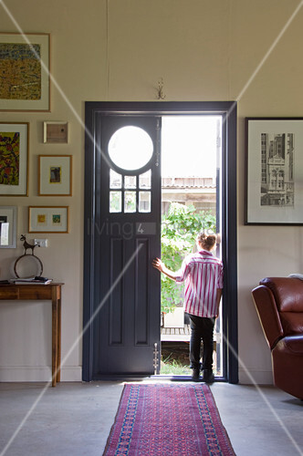 Person Standing In Open Front Door Buy Image 12674718