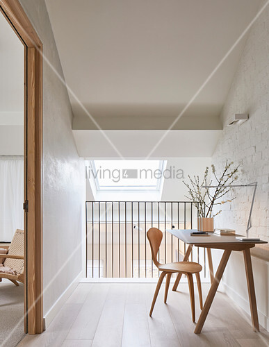 Desk And Chair Against Whitewashed Brick Buy Image