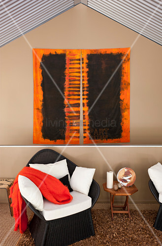 Artwork On Wall Above Rattan Armchair Image 12556680 Artwork On Wall Above Rattan Armchair